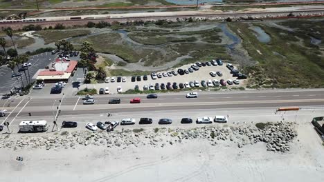 aerial view from a drone tilting up over the coast showing the land