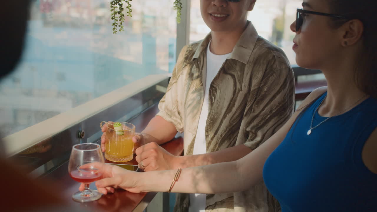Friends Relaxing with Cocktails at Downtown Bar