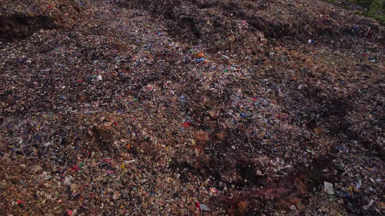 Shocking aerial of a large landfill filled with hills of garbage in Nigeria, Africa