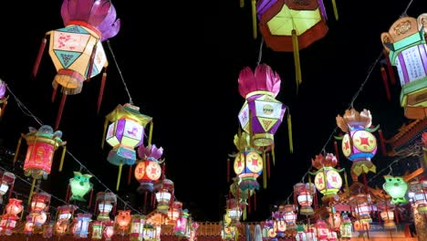 numerous colorful lanterns, which symbolize prosperity and good fortune, hanging from ceiling wires during the mid-autumn festival, also called mooncake festival