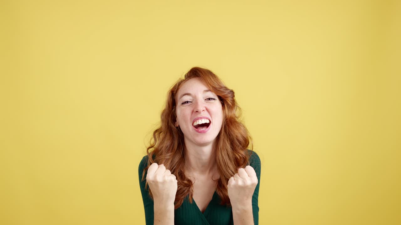 Expressive Red-Haired Woman with Freckles Showing Various Emotions on Yellow Background