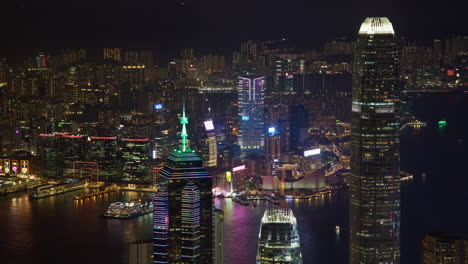 hong kong victoria harbour closeup view of tsim sha tsui cityscape night timelapse of city lights and skyscrapers