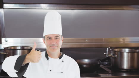 animation of caucasian male chef over empty kitchen