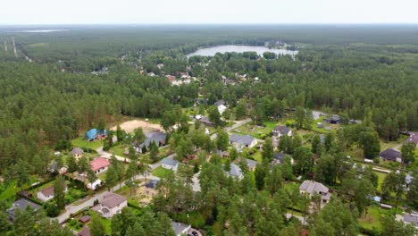 forest surrounding luxury living area near riga city, aerial view