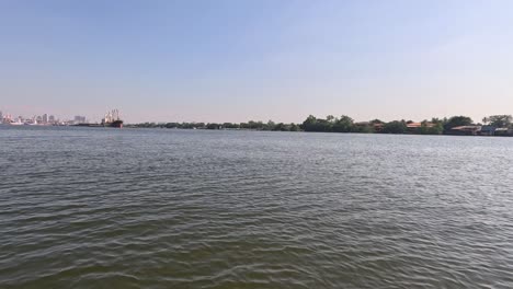 boat moves towards dock on a sunny day