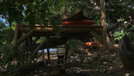 mother and son relaxing on wooden deck among the trees