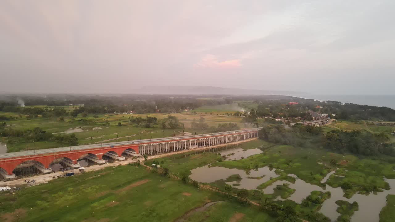 Aerial view of Pandansimo Bridge in Yogyakarta, the southern Java cross bridge is under construction. Adjacent to Baru Beach.