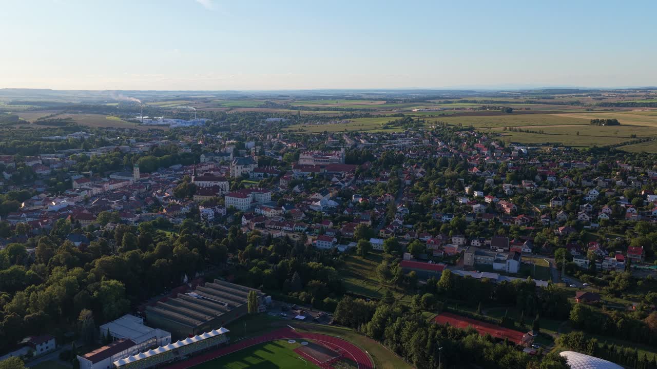 Drone view of Litomyšl, showcasing the town’s rooftops, historic buildings, and surrounding landscape