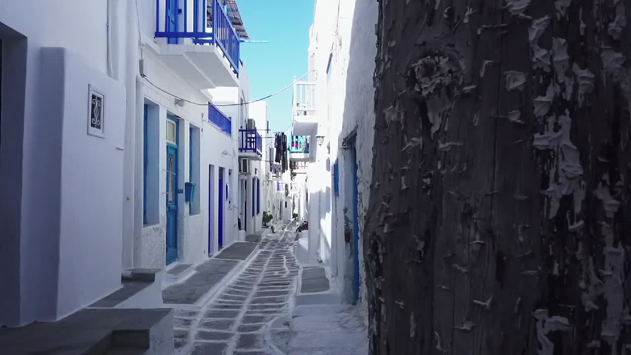 Picturesque Whitewashed Alley with Blue Accents in a Mediterranean Village