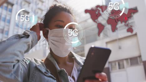 Multiple-5G-text-on-circles-moving-against-woman-wearing-face-mask-using-smartphone