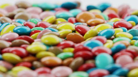 colorful coated chocolate candies rotating