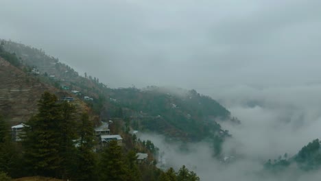 Rotating-aerial-shot-of-foggy-morning-in-Shangla-Pass-in-Khyber-Pakhtunkhwa,-Pakistan