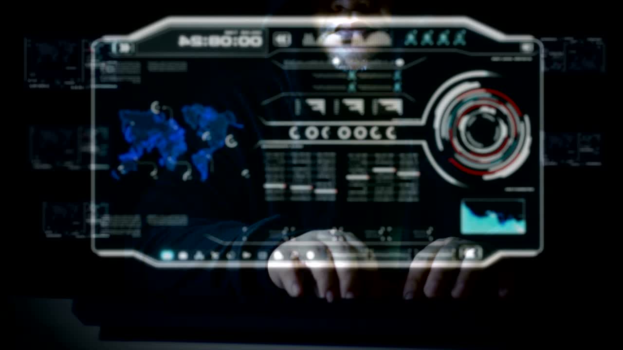 Hacker using keyboard with user interface HUD code for cyber criminal cyber attack and futuristic concept with dark and grain processed
