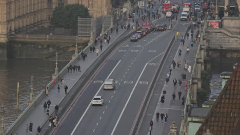 traffic and people crossing westminster bridge london