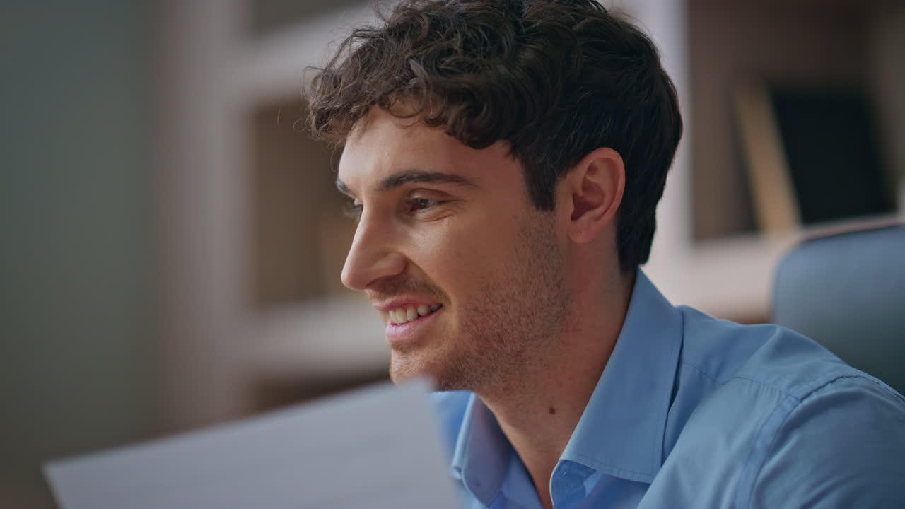 Closeup manager looking idea study papers in office. Smiling man solving problem