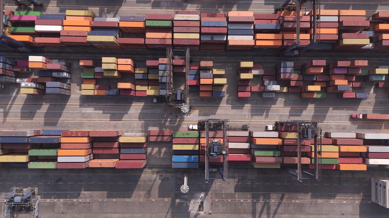 Industrial container port in Veracruz, Mexico, with cranes moving colorful cargo containers