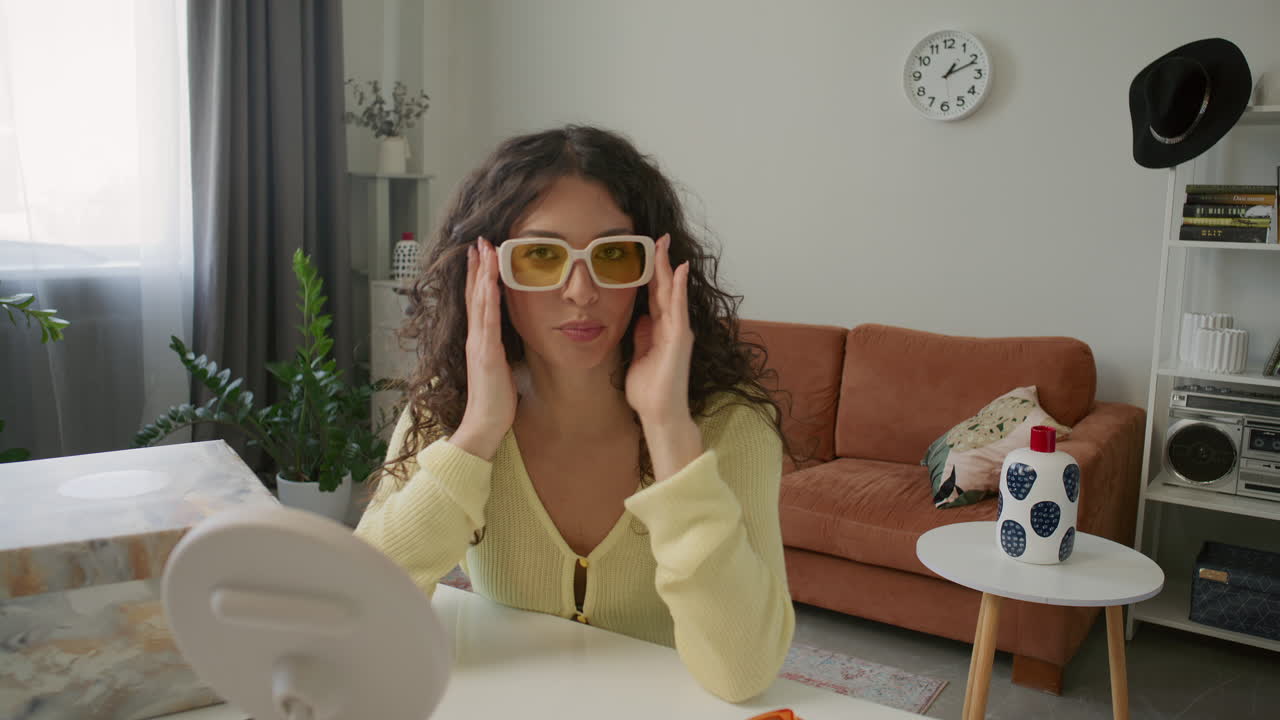 Fashion Influencer Discussing Sunglasses as Filming Social Media Vlog at Home
