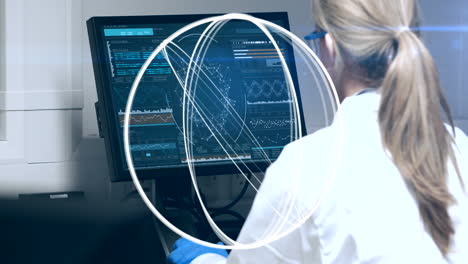 animation of circles spinning over female scientist using computer