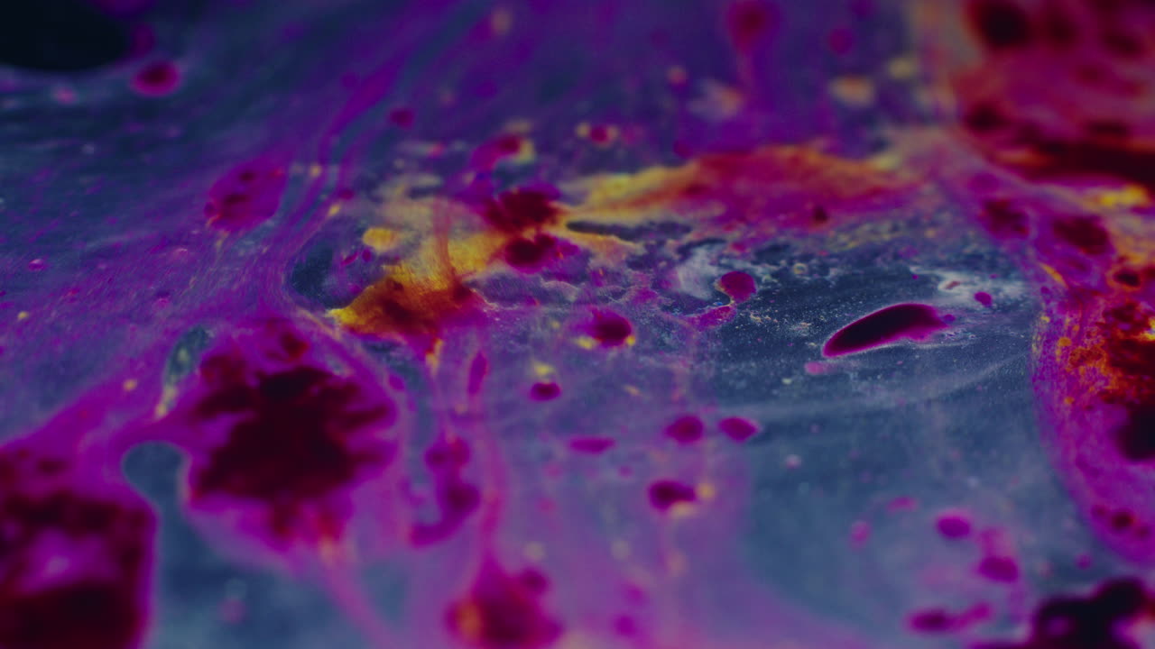 Colourful, organic, liquids macro shots buzzing and flowing