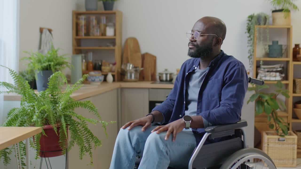 Portrait of African American Man in Wheelchair at Home