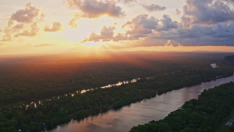 aerial view of a river at sunset in the amazon rainforest