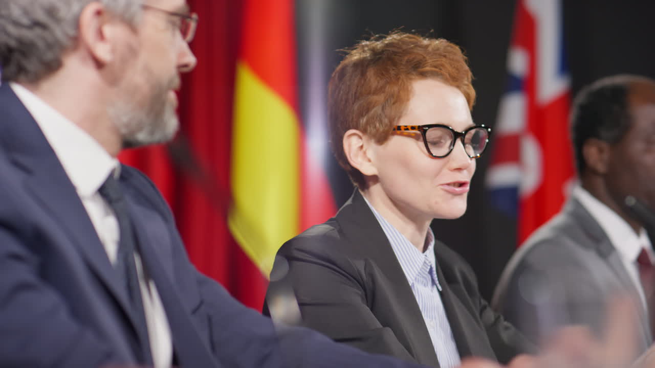 Male and Female Politicians Speaking at Press Conference