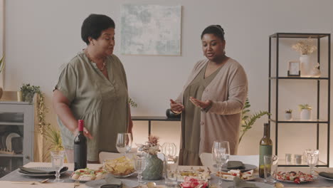 two women preparing for a dinner party