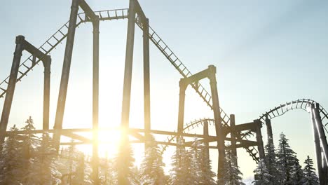 old roller coaster at sunset in forest