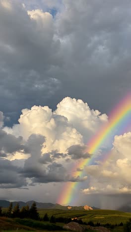 rainbow over mountains and clouds