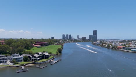 scenic river view with luxury homes and boats