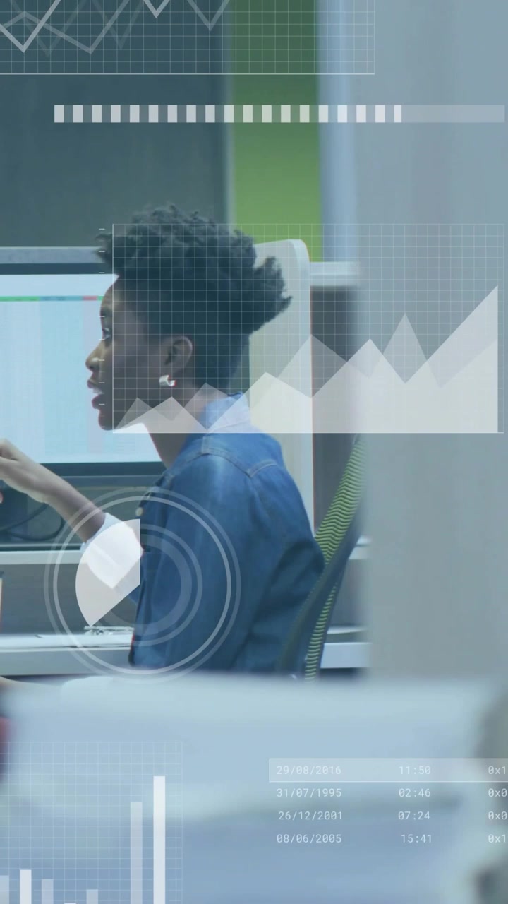 Woman starting data explanation in cubicle, gesturing at monitor while animated charts intensifying