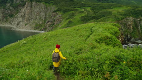 woman hiking on a coastal trail