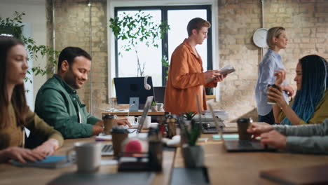 colleagues talking coffee break sitting workplace. coworkers drinking beverage