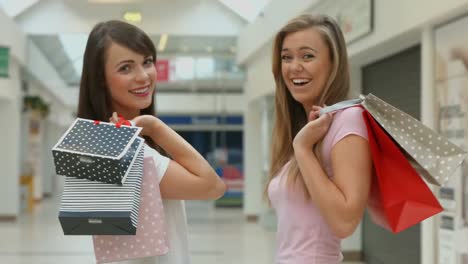 happy friends in the shopping mall