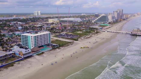 aerial drone reveal of daytona beach coastline on a sunny summer day