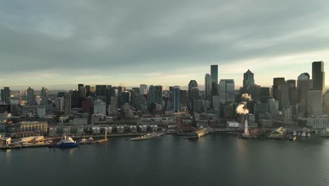 drone view of seattle waterfront and belltown neighborhood from puget sound perspective