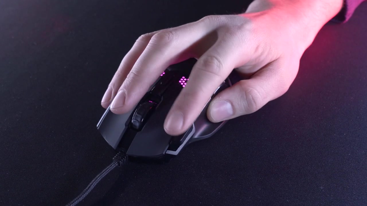 Close-up of Hand Operating a Gaming Computer Mouse with LED Lights