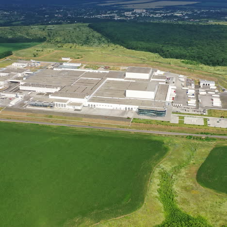 view from above on a modern industrial estate among green trees. huge manufacturing plant outdoors. aerial view.