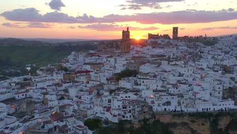 white town on cliff at sunset