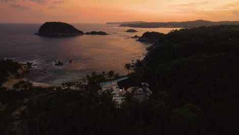 Aerial-of-sunset-landscape-along-the-mesmerizing-coastline-in-Huatulco,-Mexico