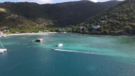 yachters delight, a speeding dinghy in the beautiful turquoise waters of paradise near foxys bar in jost van dyke, british virgin islands