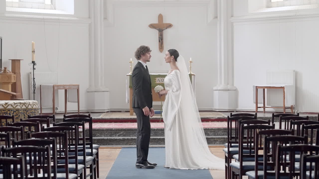 Couple Standing in Church During Wedding Ceremony
