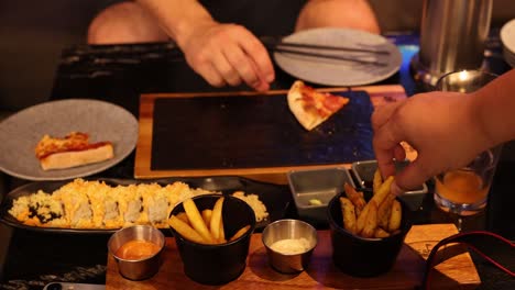 friends enjoying fries and snacks together