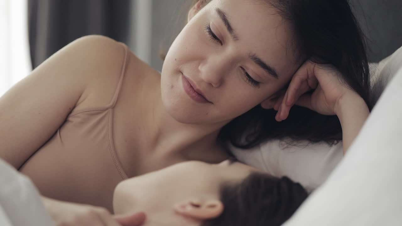 Intimate couple relaxing in bed