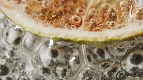 lime slice in soda water