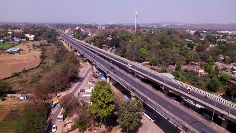 tilwara bridge with indian flag and trees at tilwara, jabalpur, madhya pradesh, india. day time, push in, drone shot, 4k.