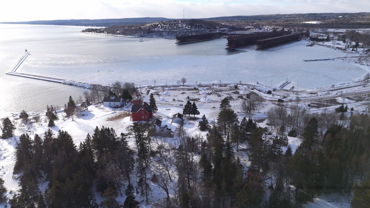 Bay at Two Harbors Minnesota during a winter sunset with Lake Superior frozen