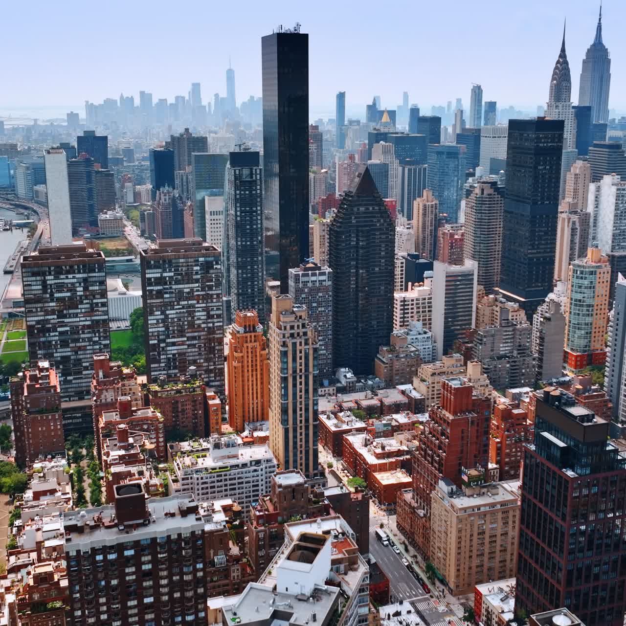 Diversity of skyscrapers design in the architecture of New York. Beautiful cityscape at waterfront from top view