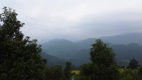 Aerial-tracking-forward-revealing-elevated-Nepal-village-landscape