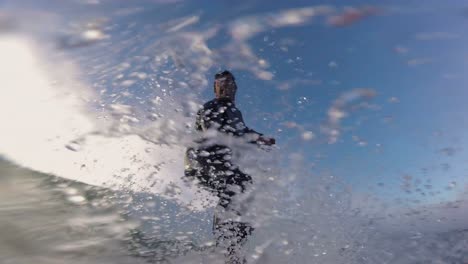 close up shot of handsome guy surfing a green wave in praia da arda surf spot